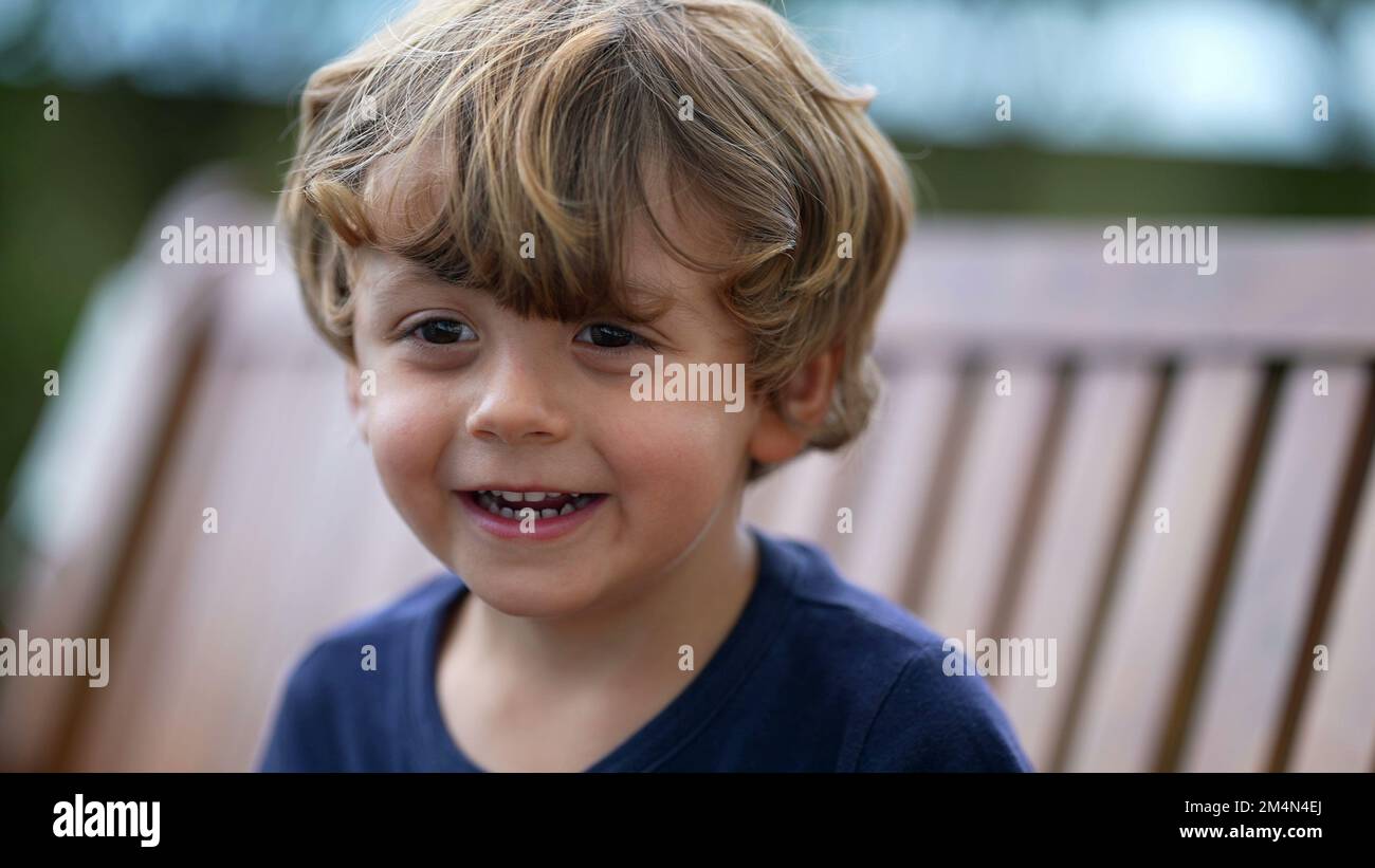 Portrait of a happy little boy. Small child face closeup laughing and