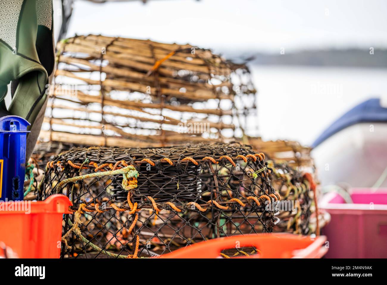 crayfish traps on a fishing boat. lobster wooden pots on the back of a