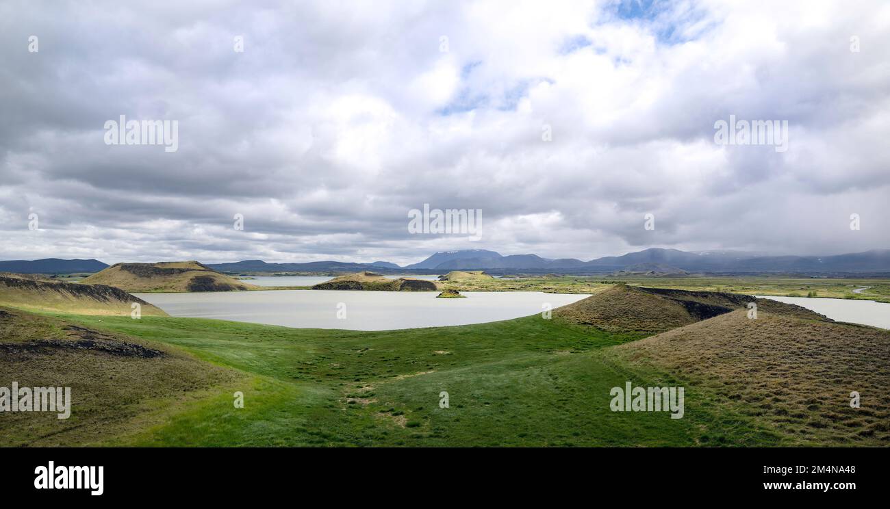 View over a lake featuring geothermal formations in iceland Stock Photo
