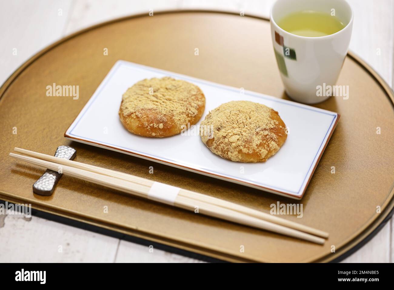 Kinako Mochi ( rice cakes coated with mixed powder roasted soybean flour and sugar), a Japanese traditional dessert Stock Photo