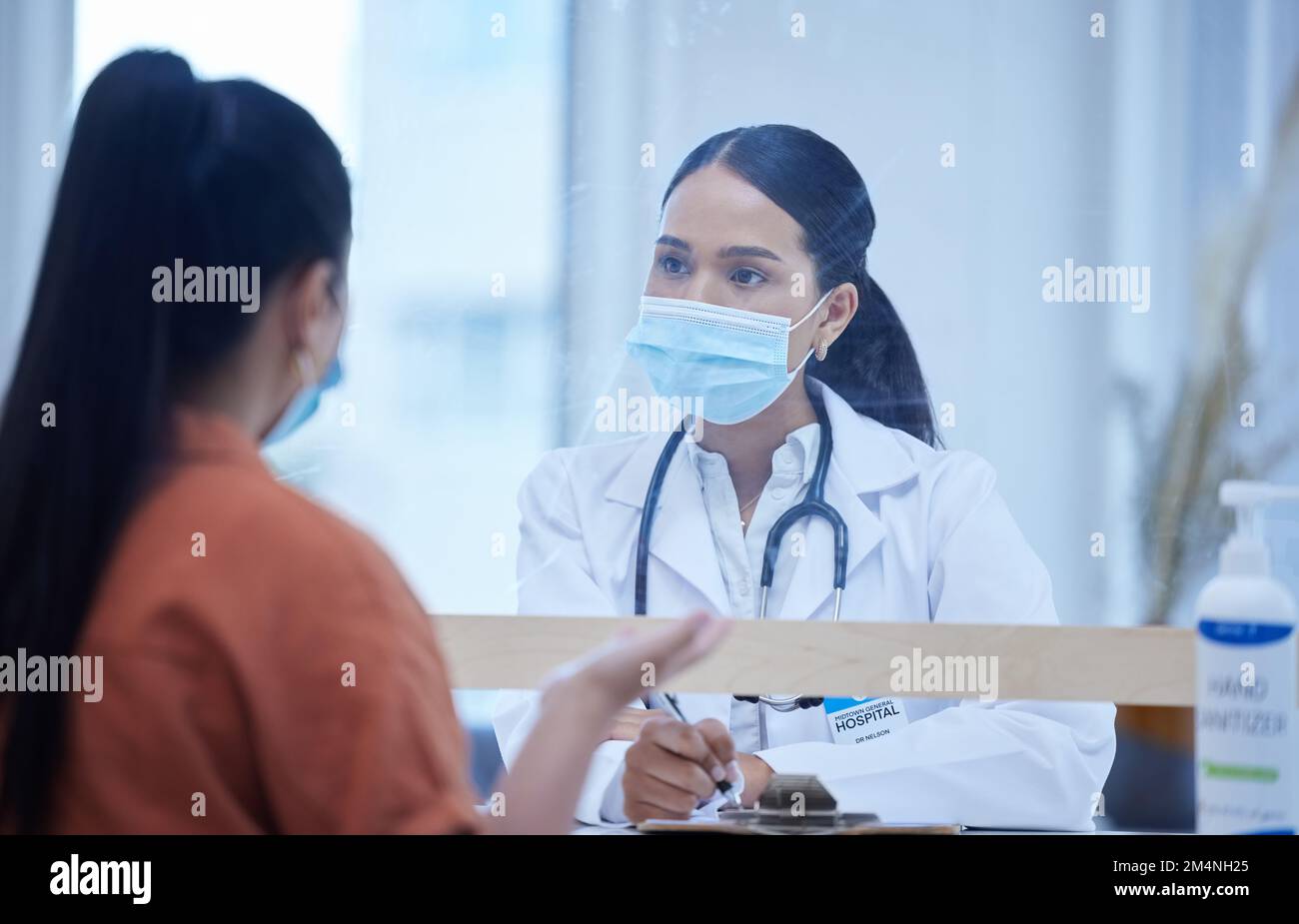 Consulting doctor, woman and covid face mask in hospital, medical