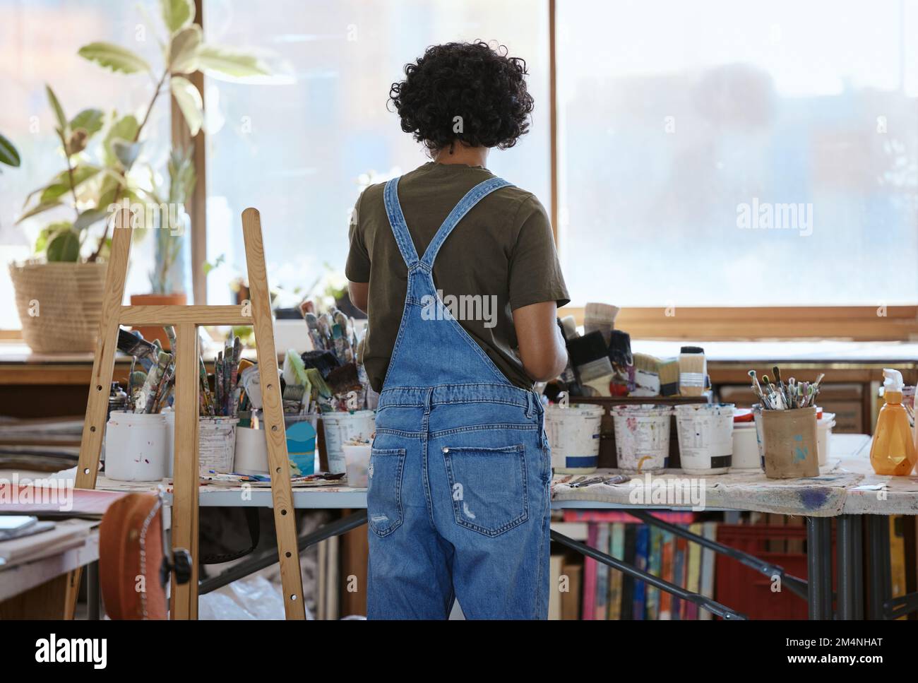 Woman, artist and painter in studio, creative or Indian art