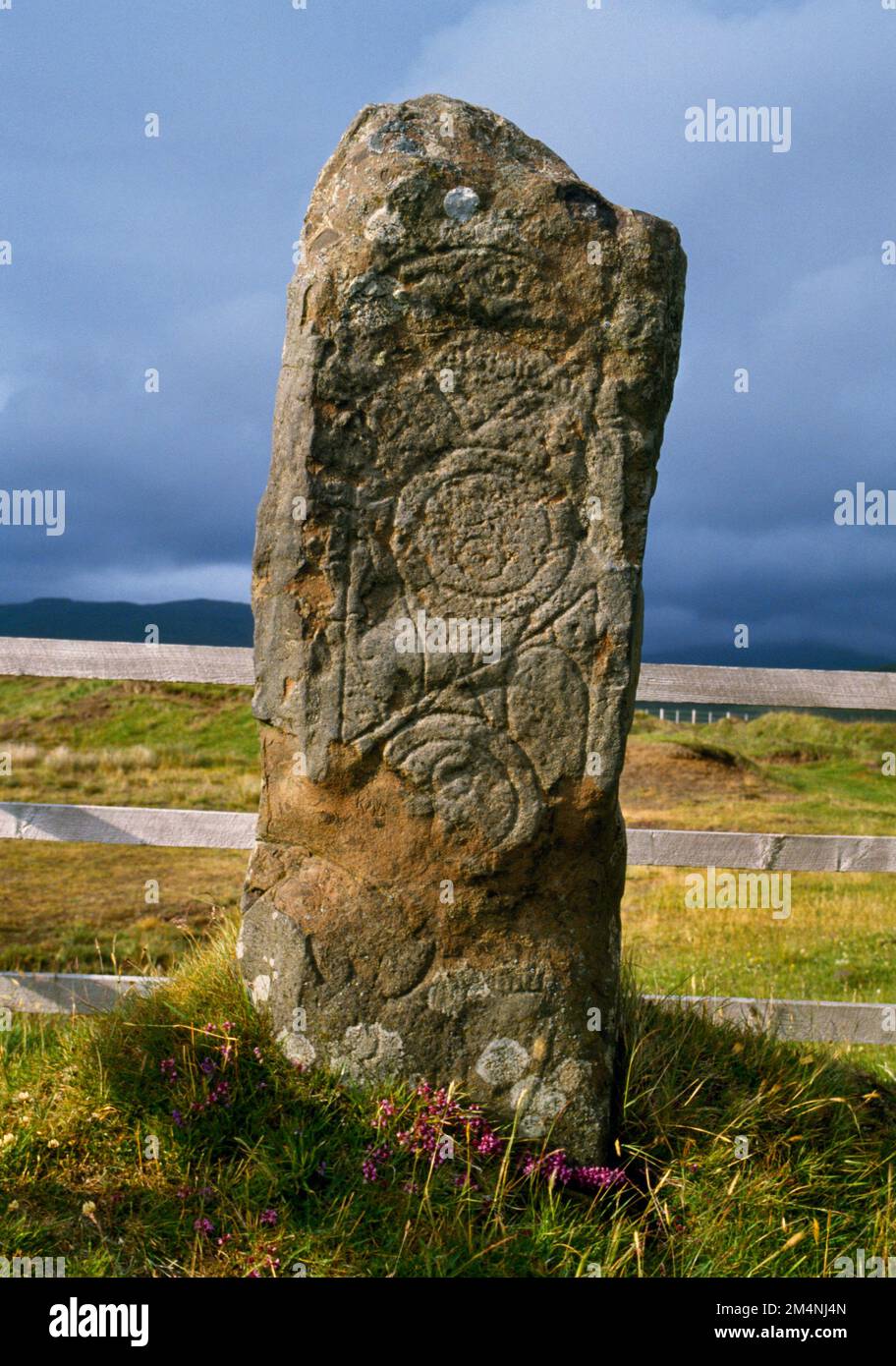 Carved south face of Clach Ard C7thAD Class I Pictish symbol stone, Tote, Isle of Skye, Scotland, UK: a basalt pillar with 3 sets of incised symbols. Stock Photo