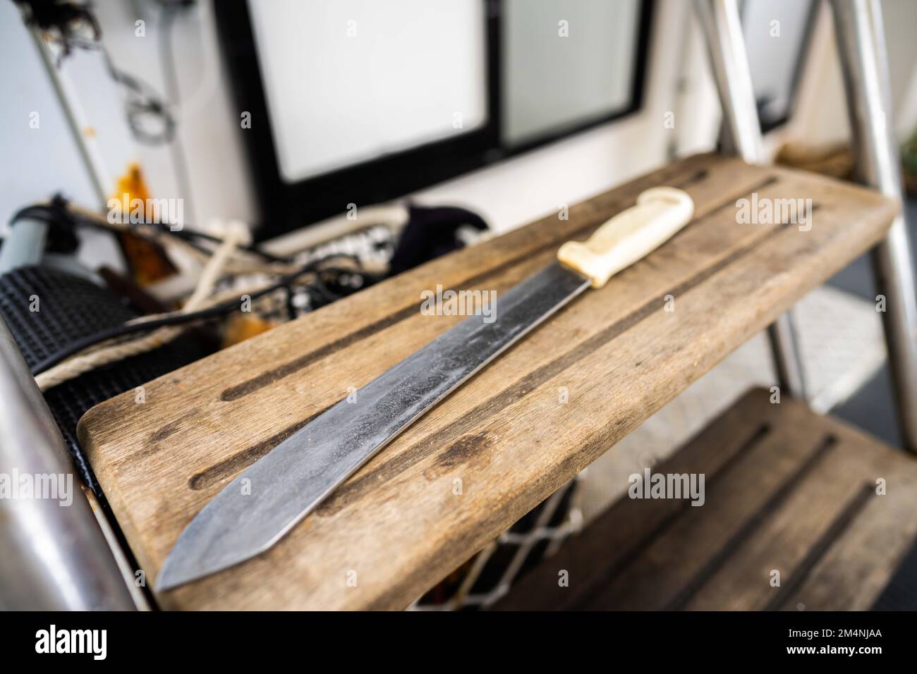 big fish gutting knife on a fishing boat in australia Stock Photo Alamy