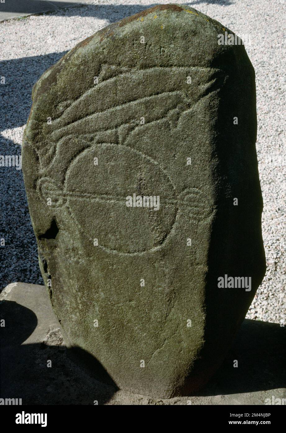 South face of Kintore Church Class I Pictish symbol stone, Aberdeenshire, Scotland, UK, incised with a fish above a triple disc & bar (= a cauldron). Stock Photo