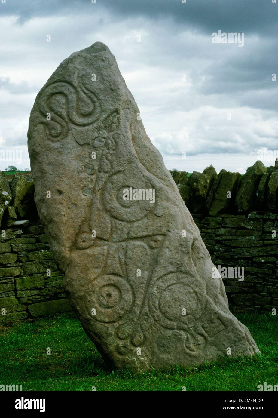 North face of Aberlemno Class I Pictish symbol stone, Angus, Scotland, UK, incised with a serpent, a double disc and Z-rod & a mirror and comb. Stock Photo