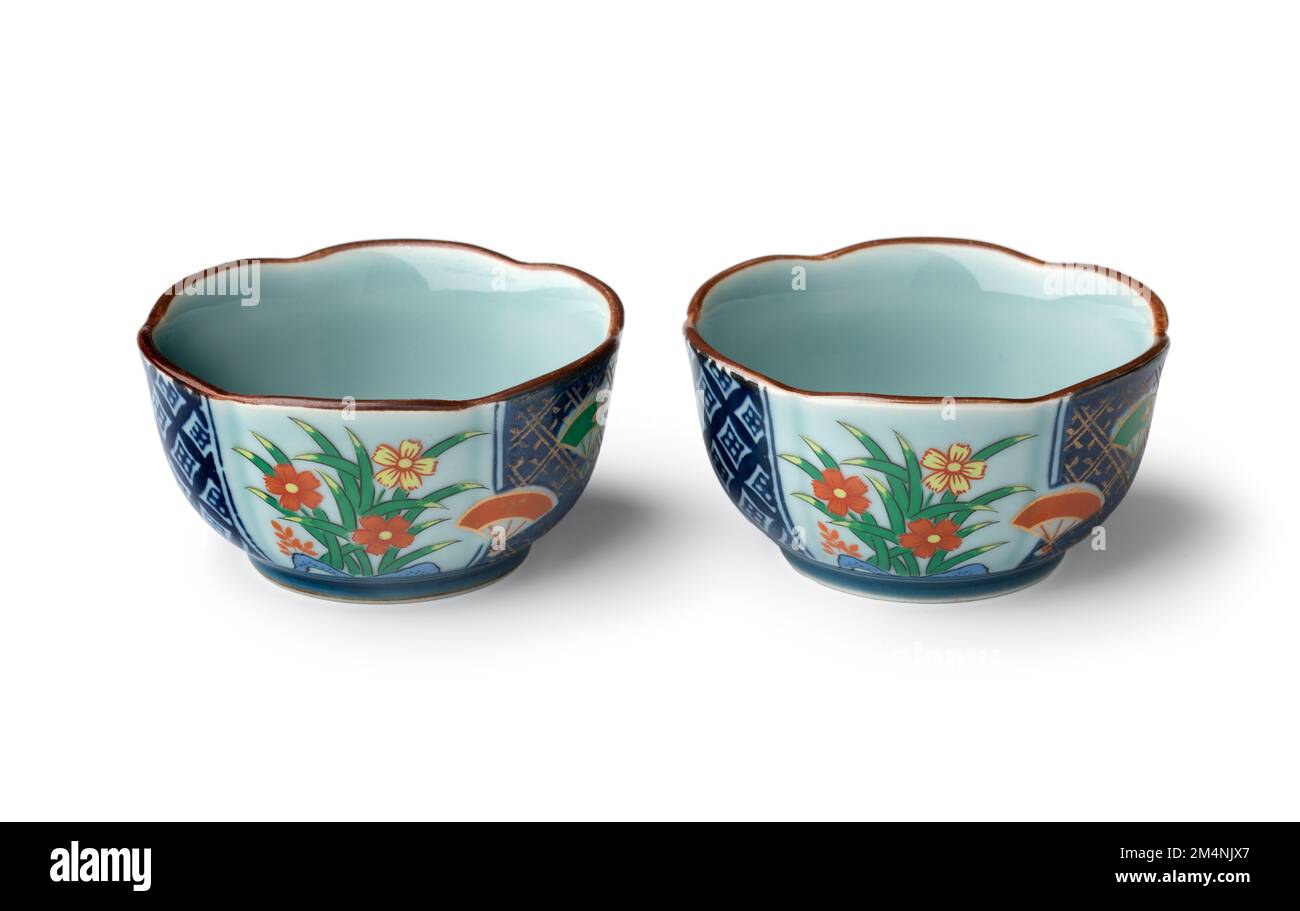 Pair of ceramic Japanese decorated small bowls isolated  on white background Stock Photo