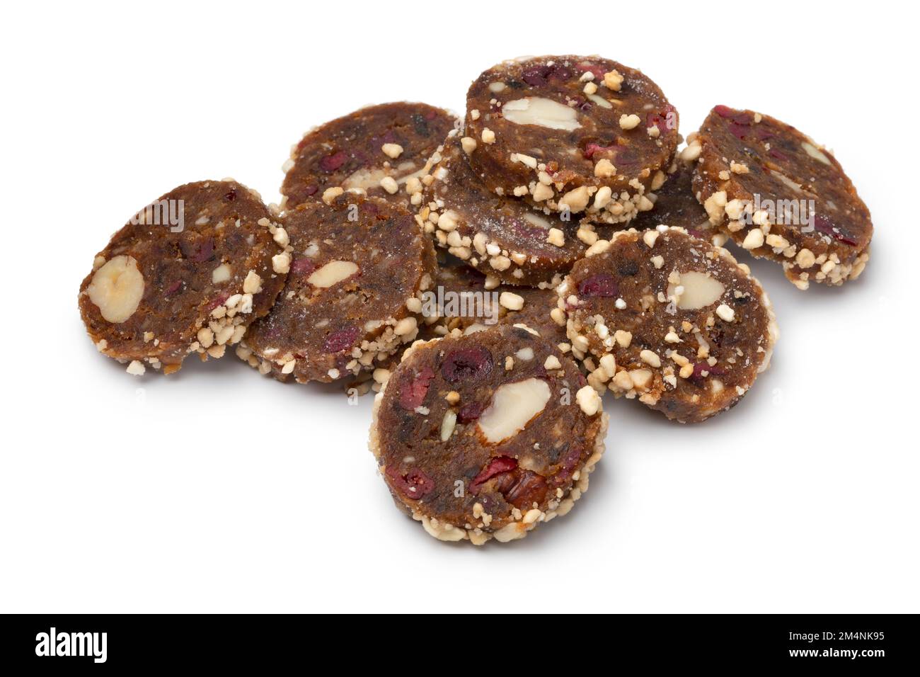 Heap of slices power food, ground dried dates, cranberries and nuts isolated  on white background Stock Photo