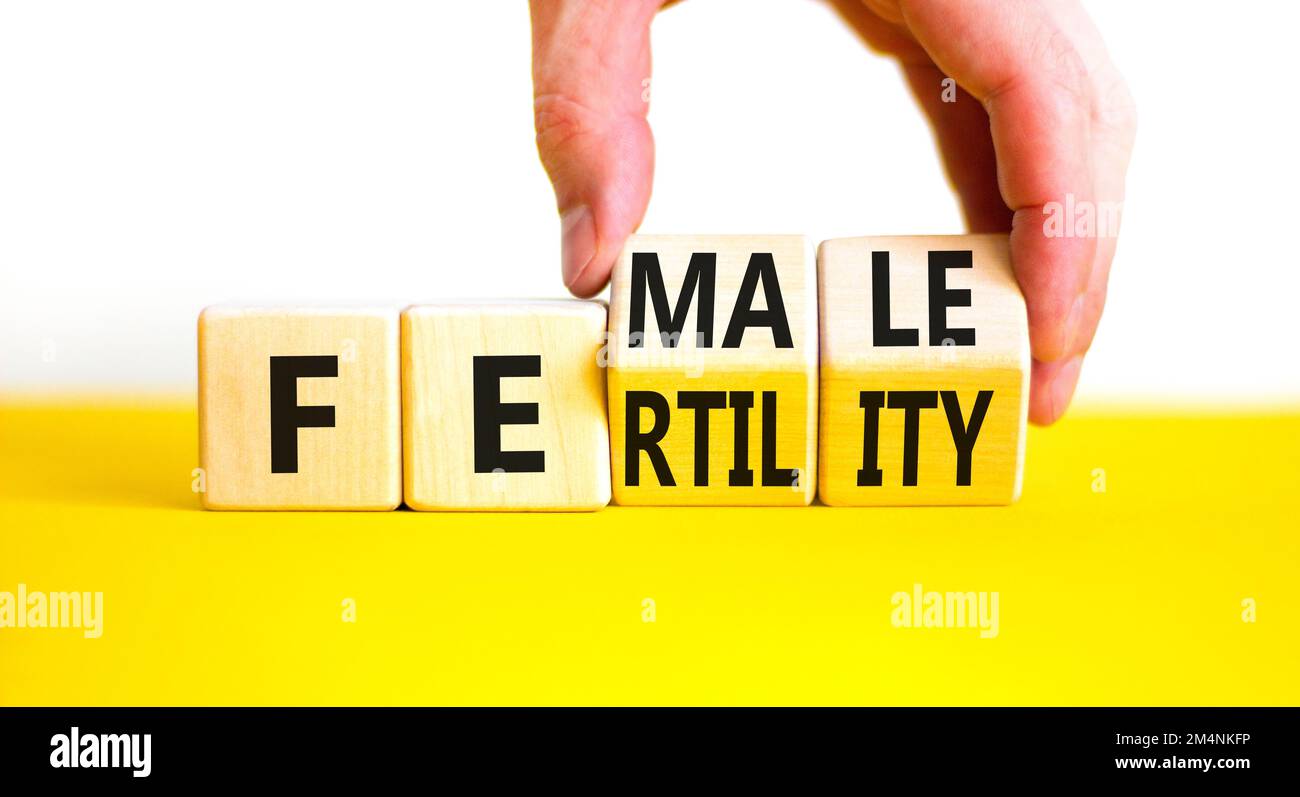 Female fertility symbol. Concept word Female fertility on wooden cubes