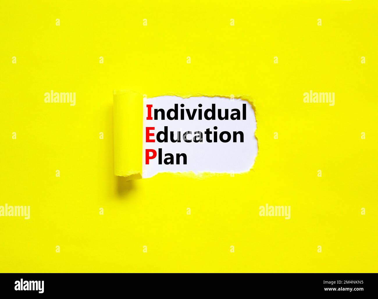 IEP individual education plan symbol. Concept words IEP individual education plan on white paper on a beautiful yellow background. Business IEP indivi Stock Photo