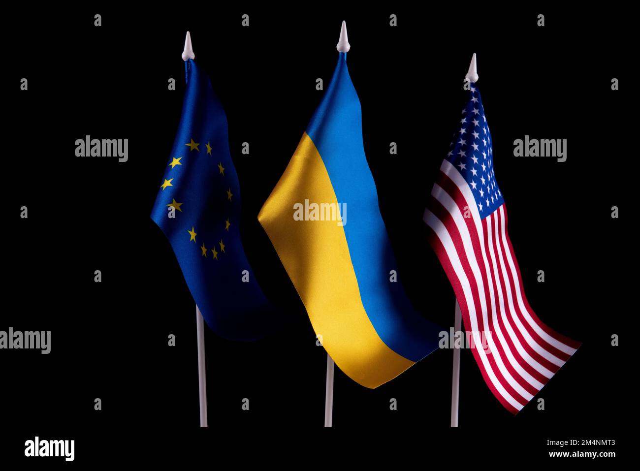 The flag of Ukraine of the United States and Europe on a black background. The concept of support for Ukraine in difficult times. Relations between Stock Photo