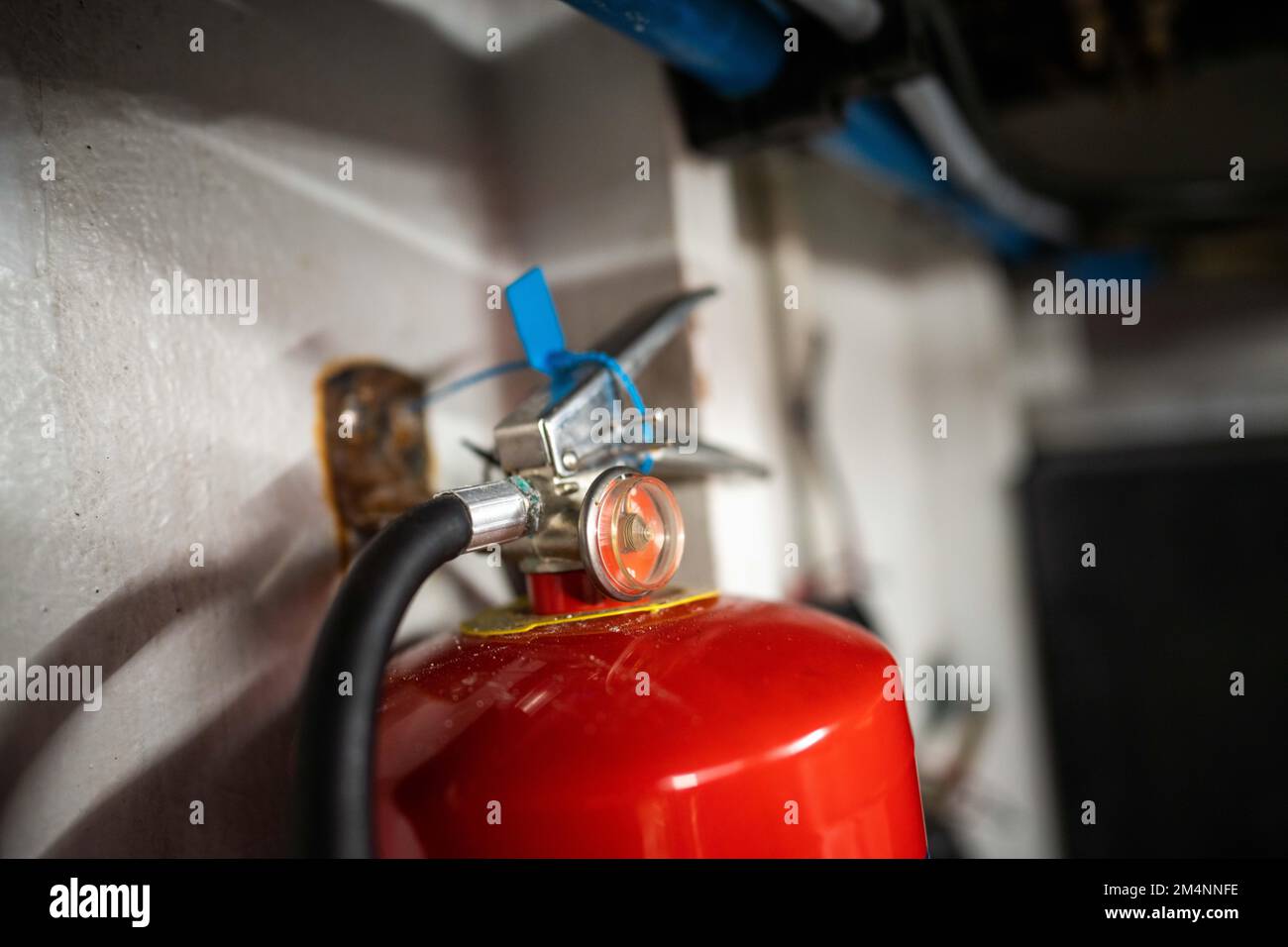 fire extinguisher in the engine room of a boat in australia Stock Photo