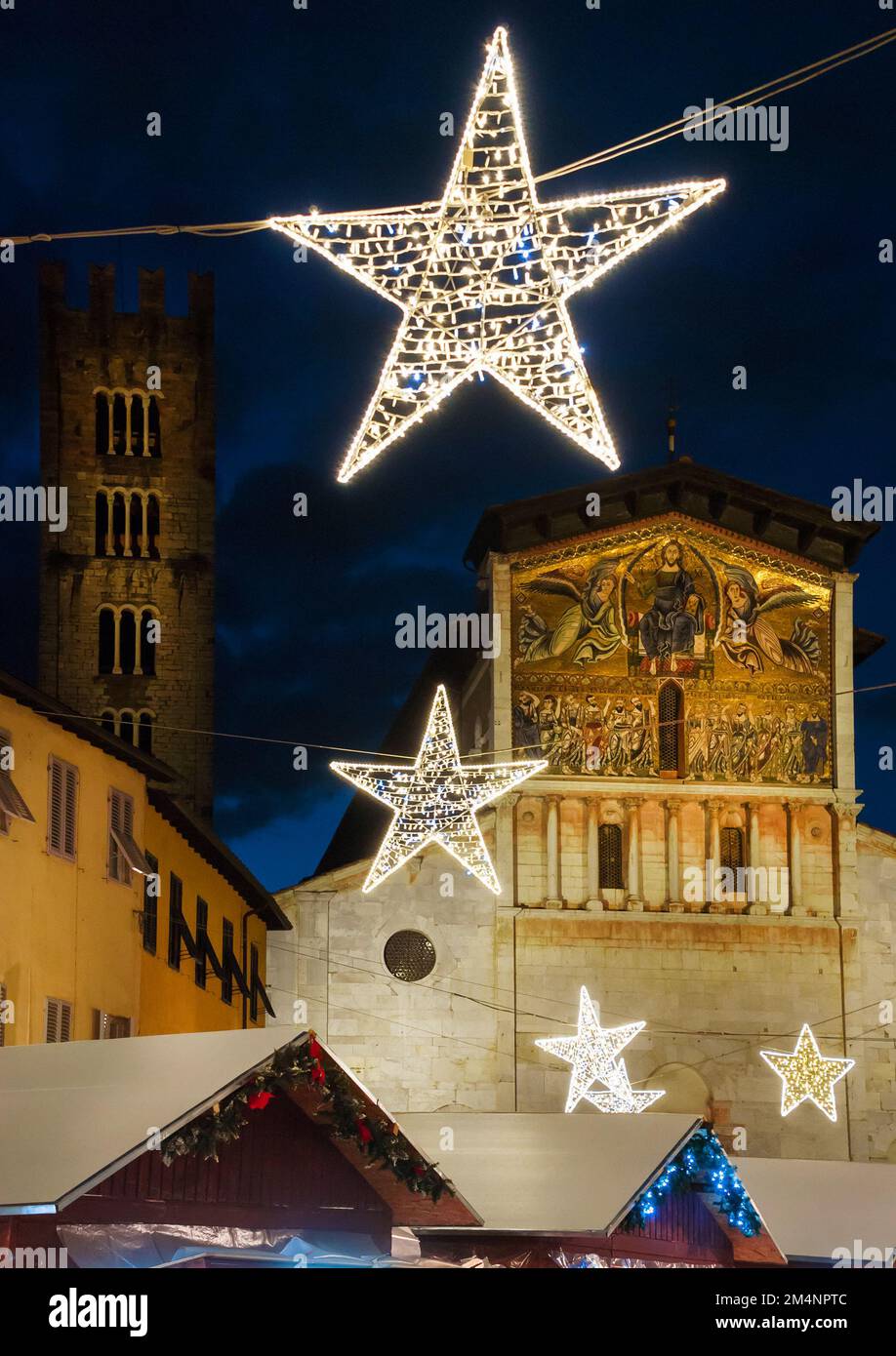 Christmas in Lucca. Christmas market with stars in front of St Frediano