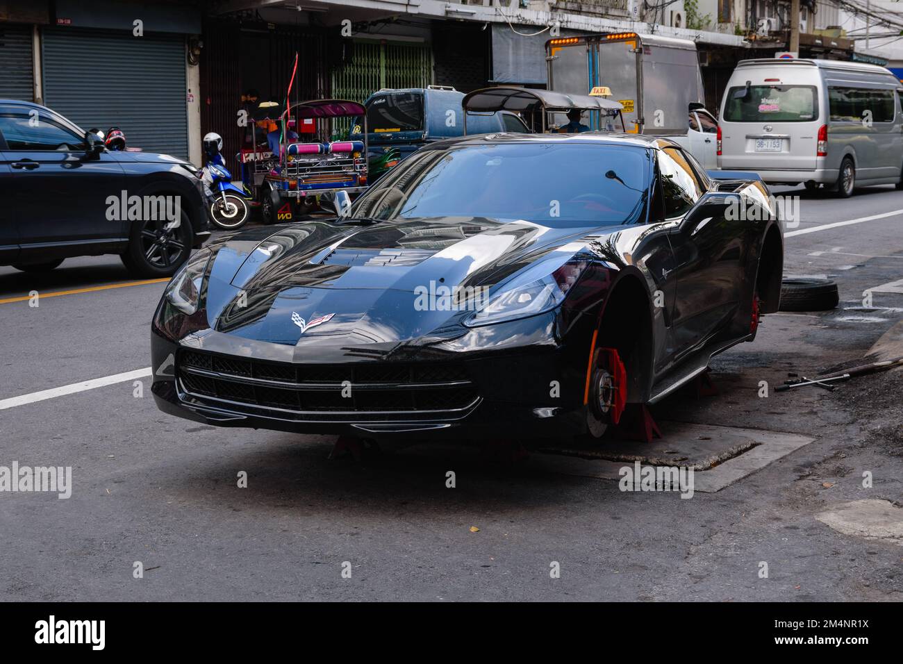 bangkok, Thailand. November 16, 2022. Black Chevrolet Corvette without wheels on the street in Chinatown, Bangkok Stock Photo