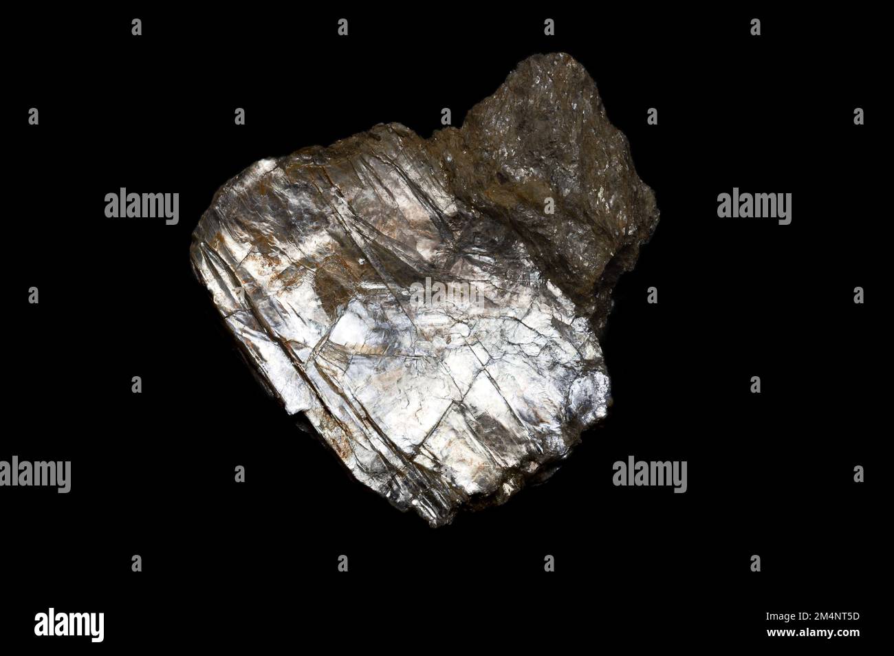 Muscovite, also known as common mica, isinglass or potash mica. Silicate mineral, with highly perfect basal cleavage, be split into thin sheets. Stock Photo