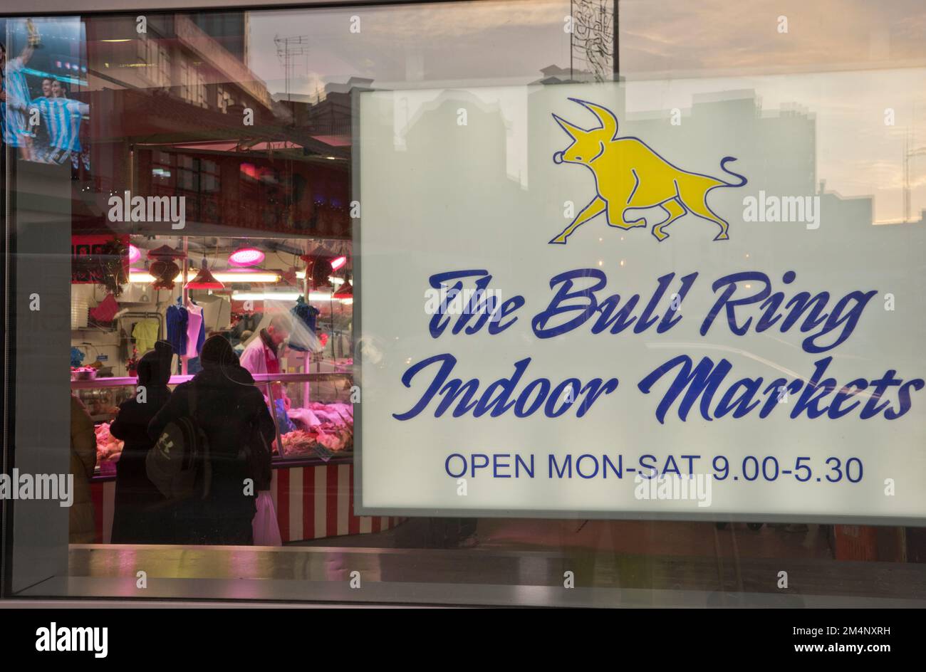 People buying meat and fish at the Bull Ring indoor markets in