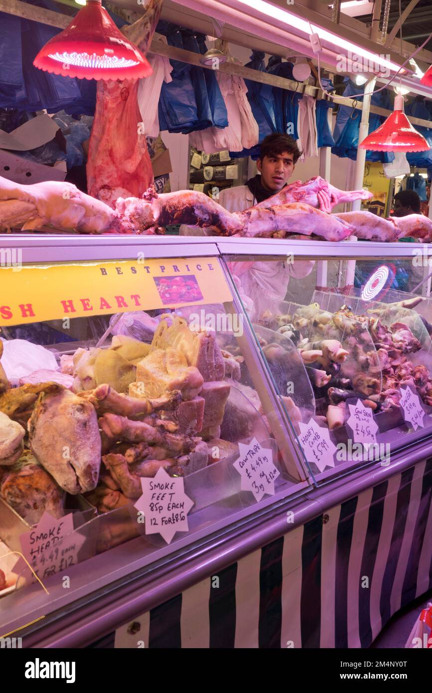 People buying meat and fish at the Bull Ring indoor markets in Birmingham,England,UK Stock Photo