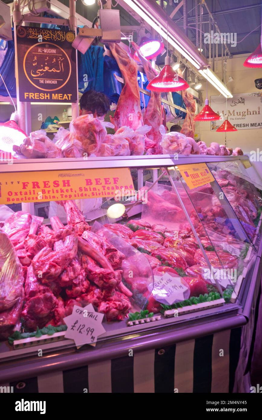 People buying meat and fish at the Bull Ring indoor markets in Birmingham,England,UK Stock Photo