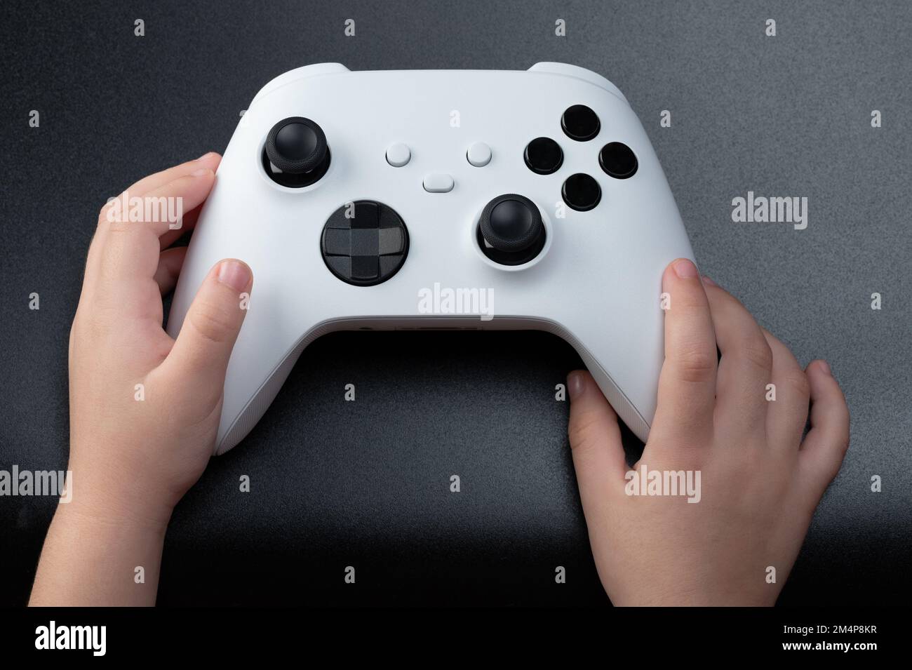 New york, USA - December 28, 2022: Next generation game consoles Microsoft  xbox and sony playstation with game pads isolated on white studio backgroun  Stock Photo - Alamy