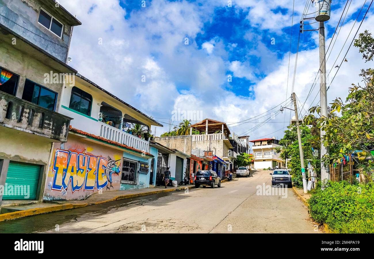 Busy road street driving cars traffic jam and places in Zicatela Puerto