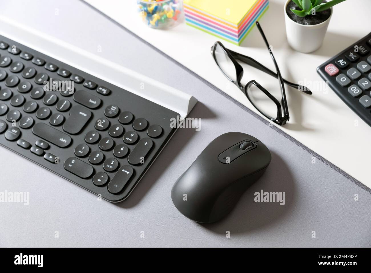 Wireless computer mouse and keyboard. Workspace at the office Stock Photo