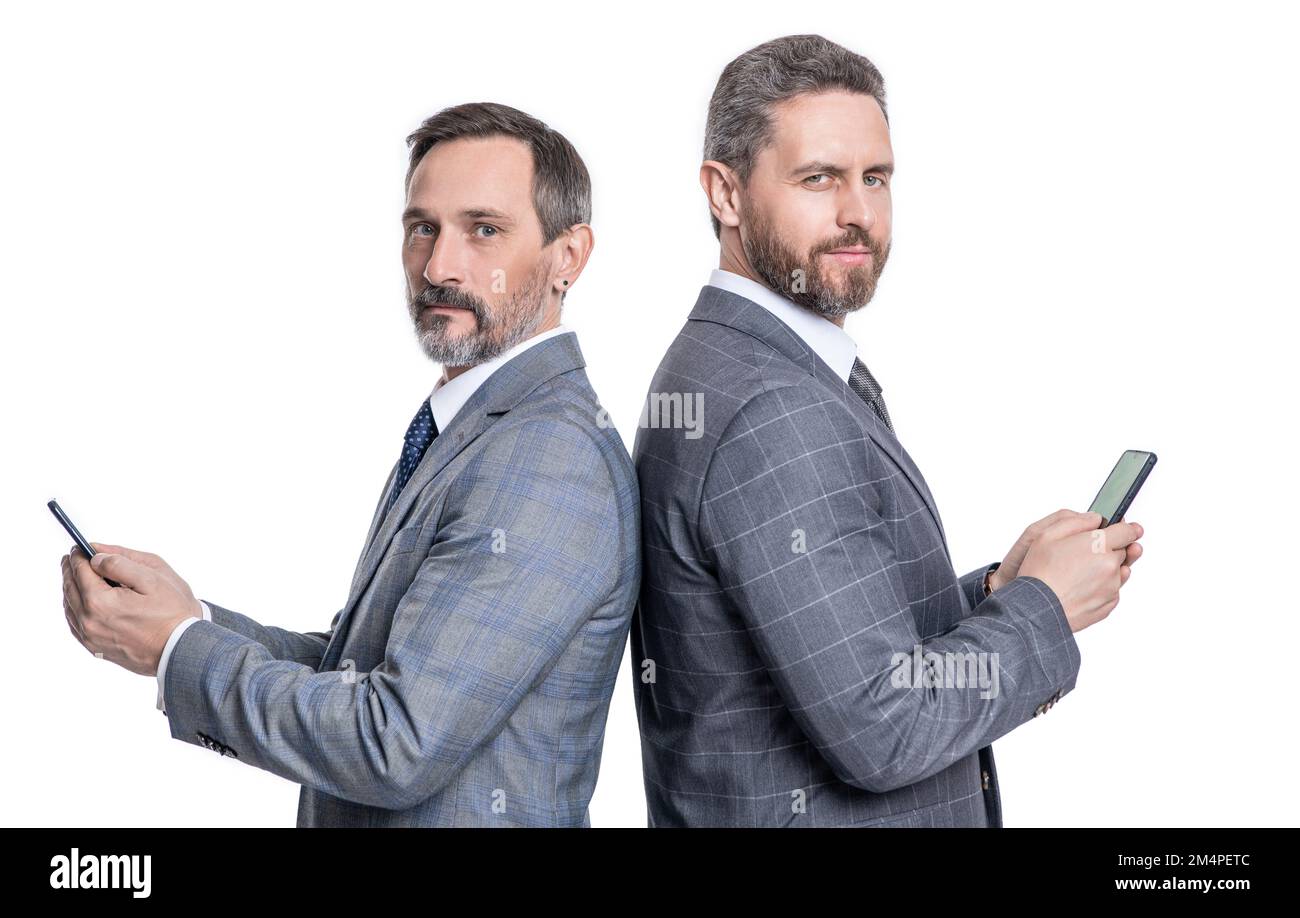men texting message on phone back to back isolated on white background ...