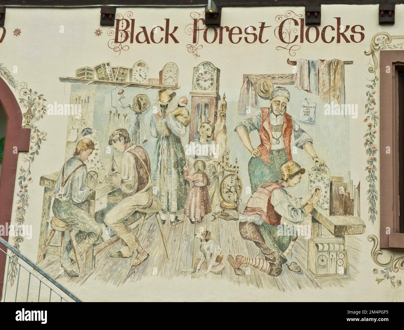 Clockmaker depicted in a facade painting of a Black Forest clock shop