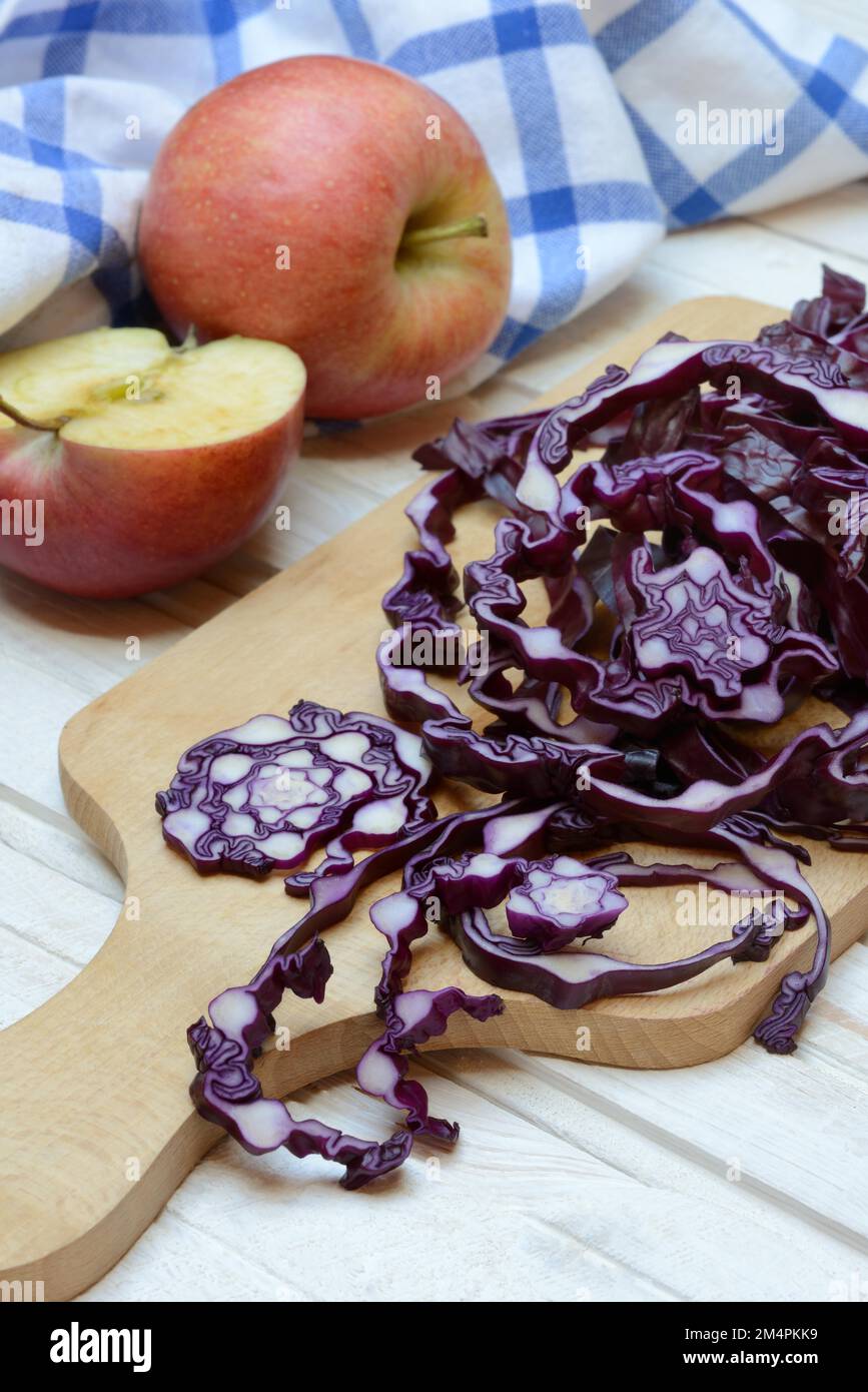 Red cabbage, sliced red cabbage and apples Stock Photo