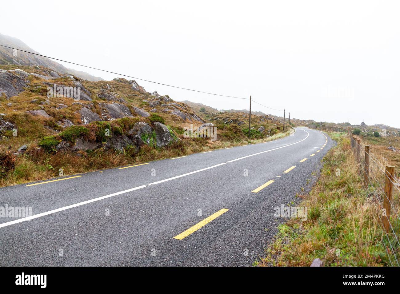 The Ring of Kerry road under a cloudy sky in Ireland Stock Photo Alamy