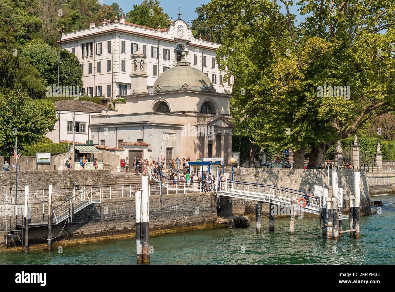 Tremezzina, Lombardy, Italy - September 5, 2022: The pier of the Villa Carlotta in Tremezzina village with tourists are waiting for the ferry boat for Stock Photo