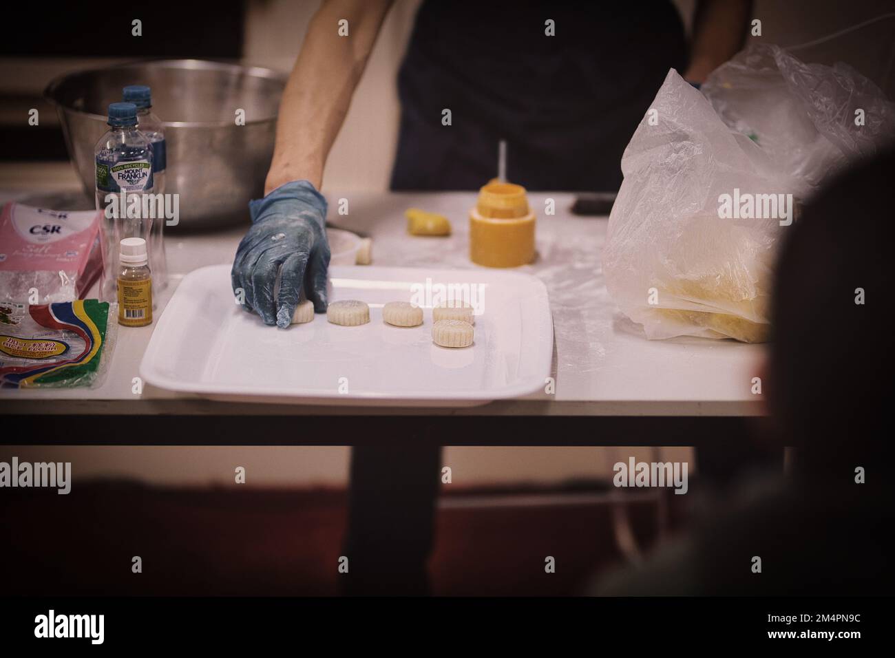 Mooncake Chef A professional chef making little mooncakes for the Mid-Autumn Festival ...