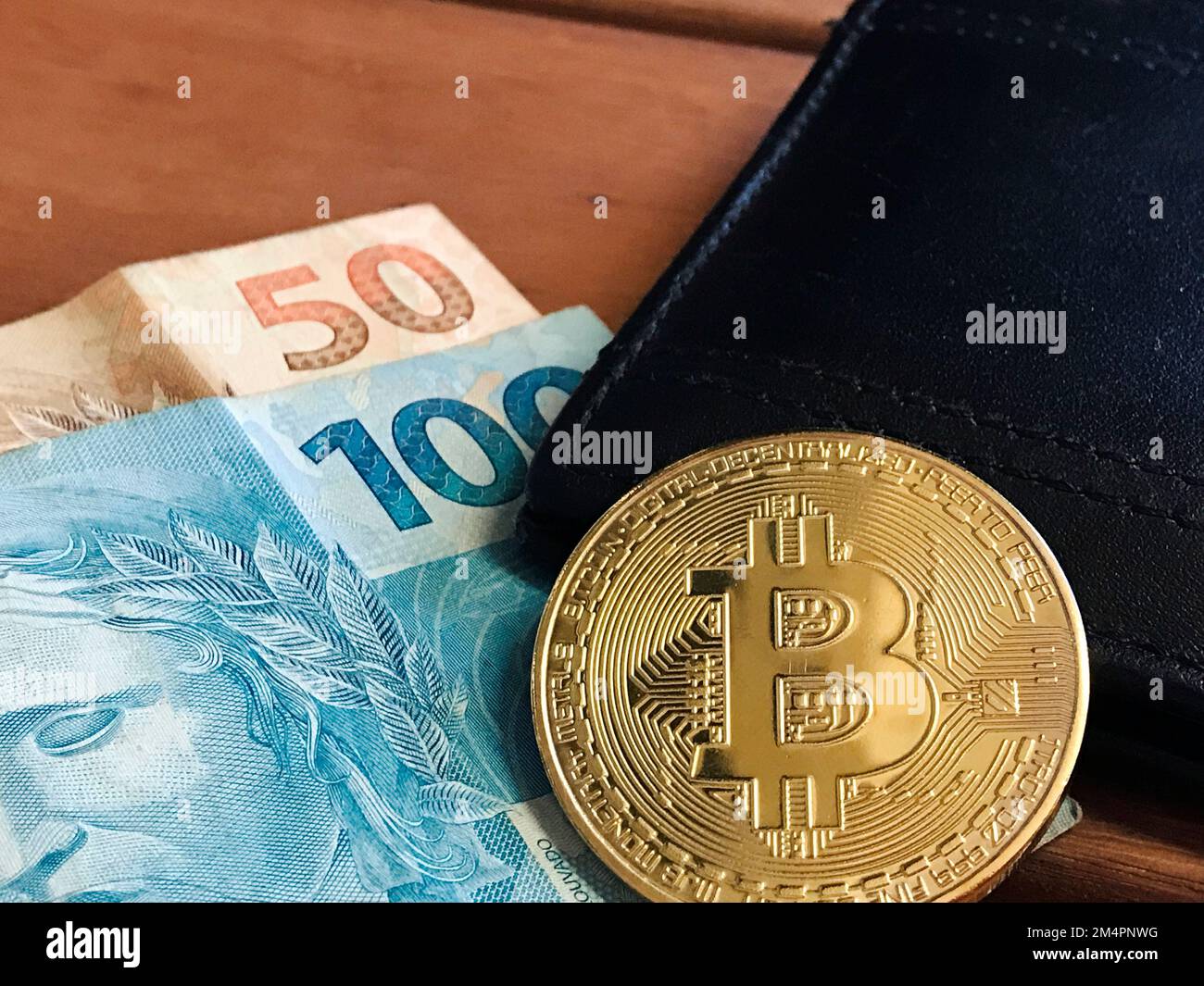 real brazilian money and virtual bitcoin Stock Photo - Alamy