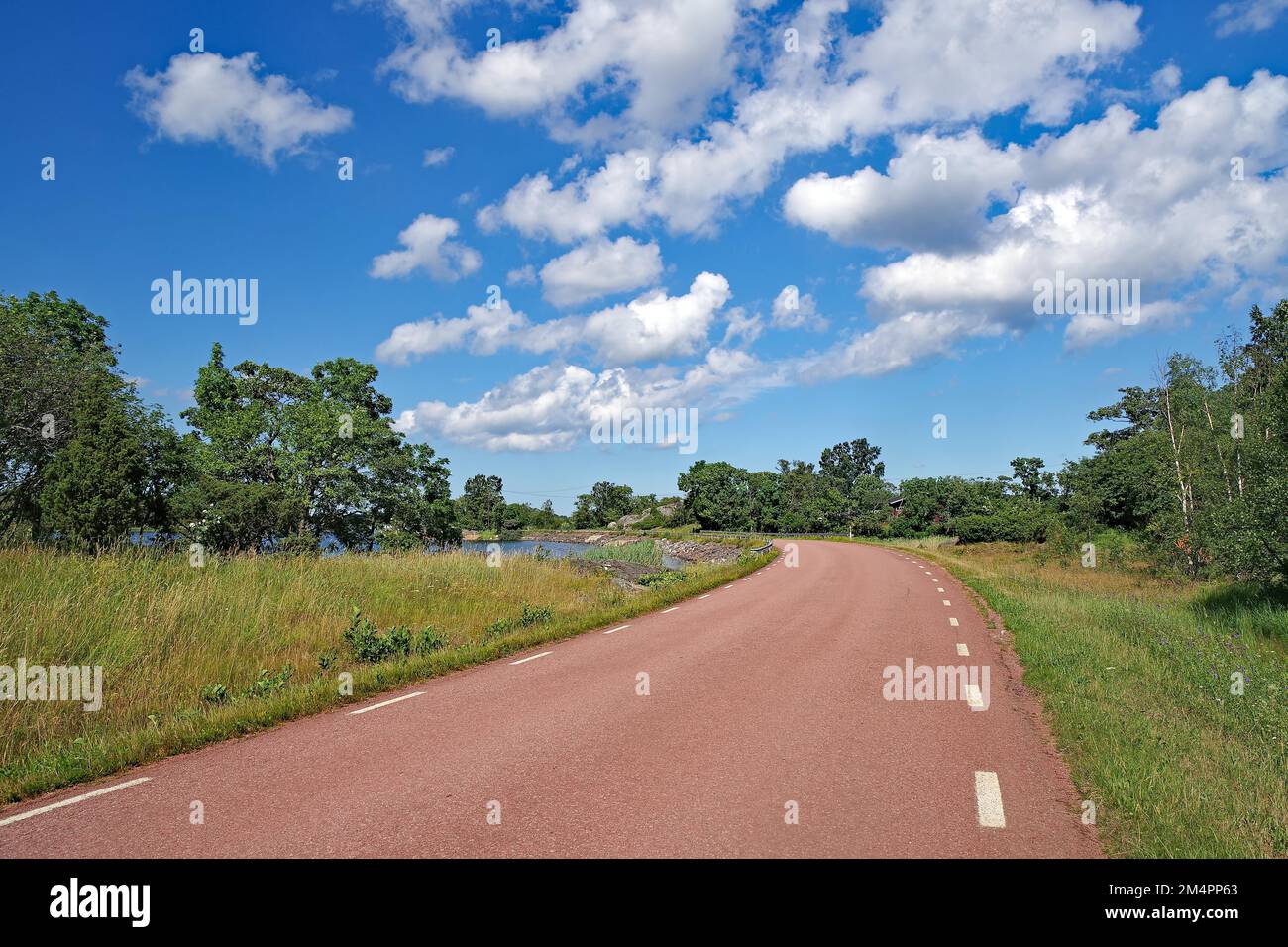 Traffic-free road leads along the sea, Baltic Sea, autonomous region, Sound, Aland Islands, Finland Stock Photo