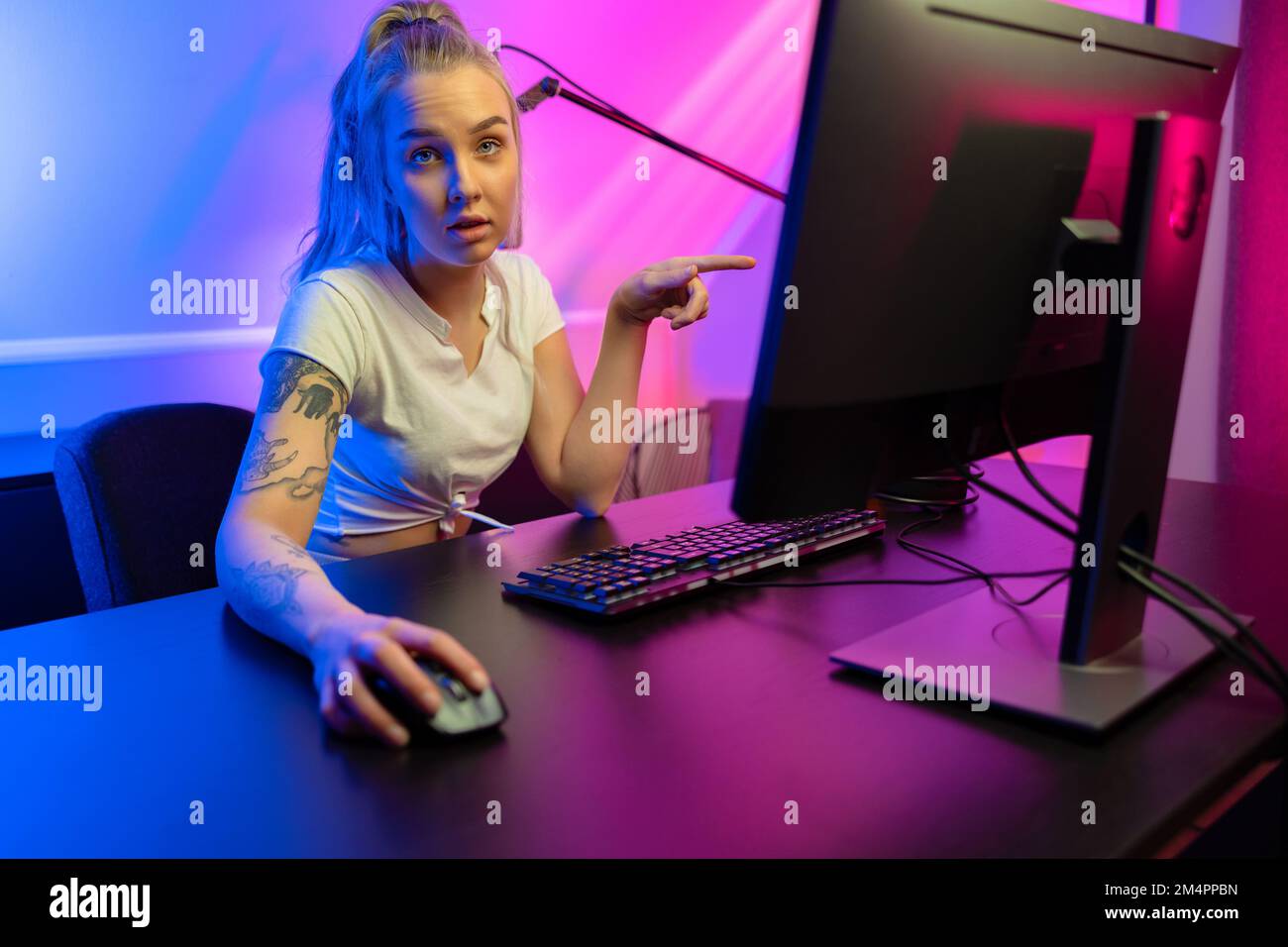 Professional esport gamer girl streaming and losing online video game on PC Stock Photo