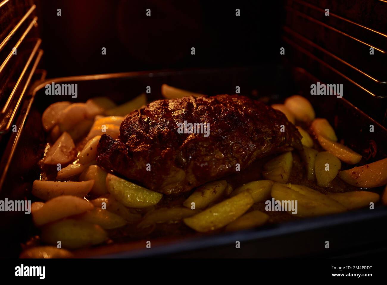 Cooking homemade food in an electric oven. Vegetable stew with potatoes