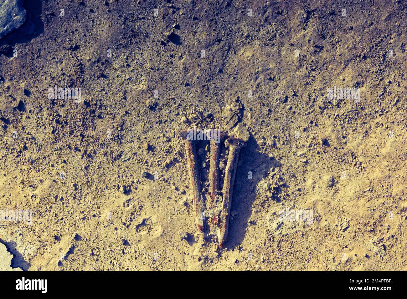 Old nails on concrete texture as abstract grunge background Stock Photo