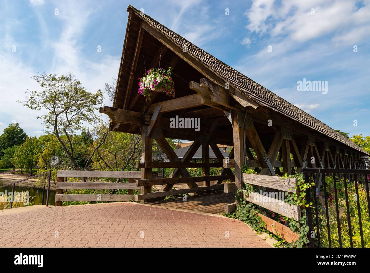 Wooden covered bridge in downtown Naperville on a beautiful sunny day