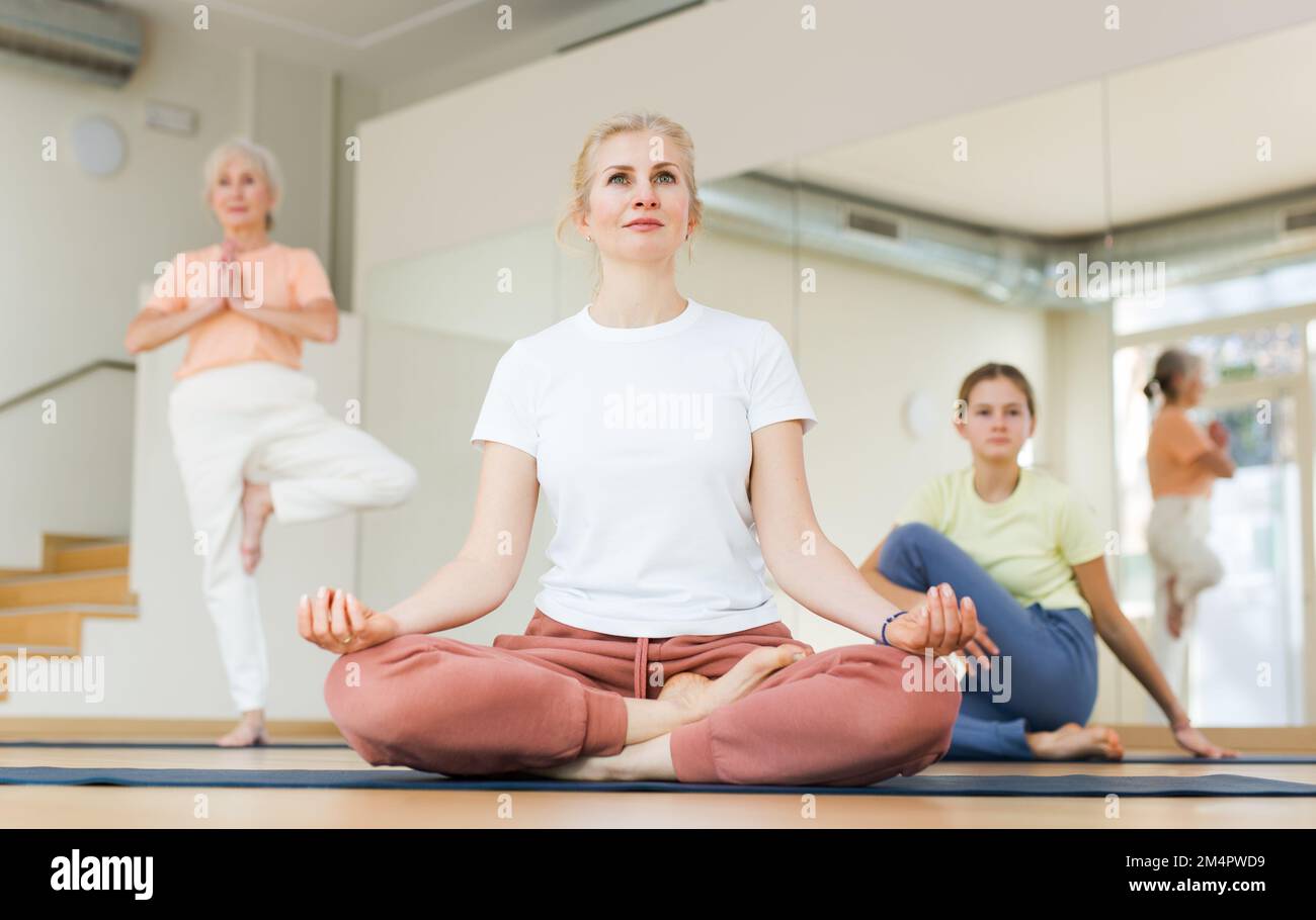 Woman practice yoga lotus pose Stock Photo - Alamy