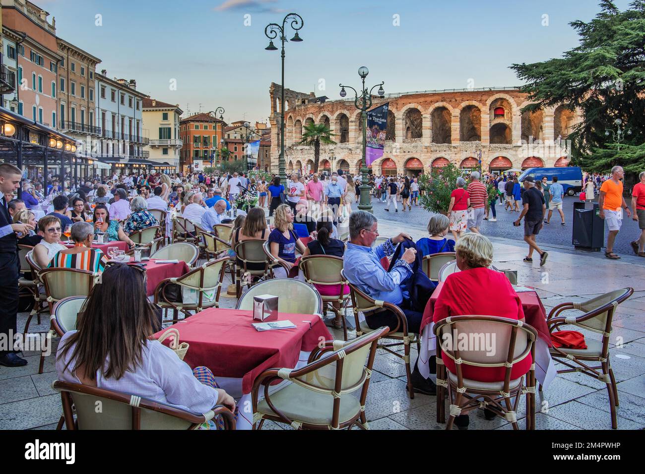 Restaurant terraces in Piazza Bra in front of the Arena di Verona, Verona, Veneto, Northern Italy, Italy Stock Photo