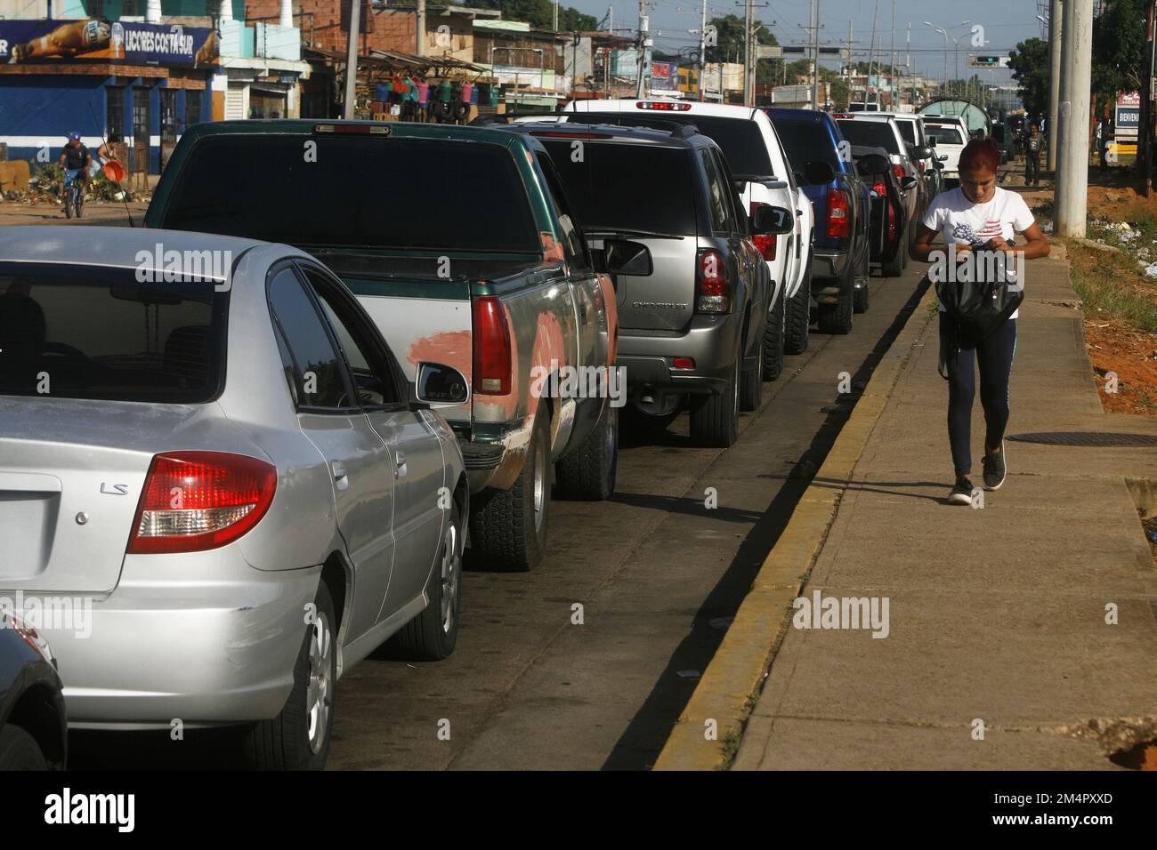 Long lines of vehicles are observed this Thursday, December 22, 2022, in the municipality of San Francisco, Venezuela. Since the beginning of the week, Venezuelans in the oil state of the country, Zulia, have been having problems accessing a few liters of fuel. And they make long lines of up to two days (48 hours) to supply their cars, trucks and motorcycles. And there is no official voice in this PDVSA case. That they inform the people, if the hydrocarbon shortage situation continues, or the supply will be normalized. Azalea Colmenares, general secretary of the Service Stations Union, pointed Stock Photo