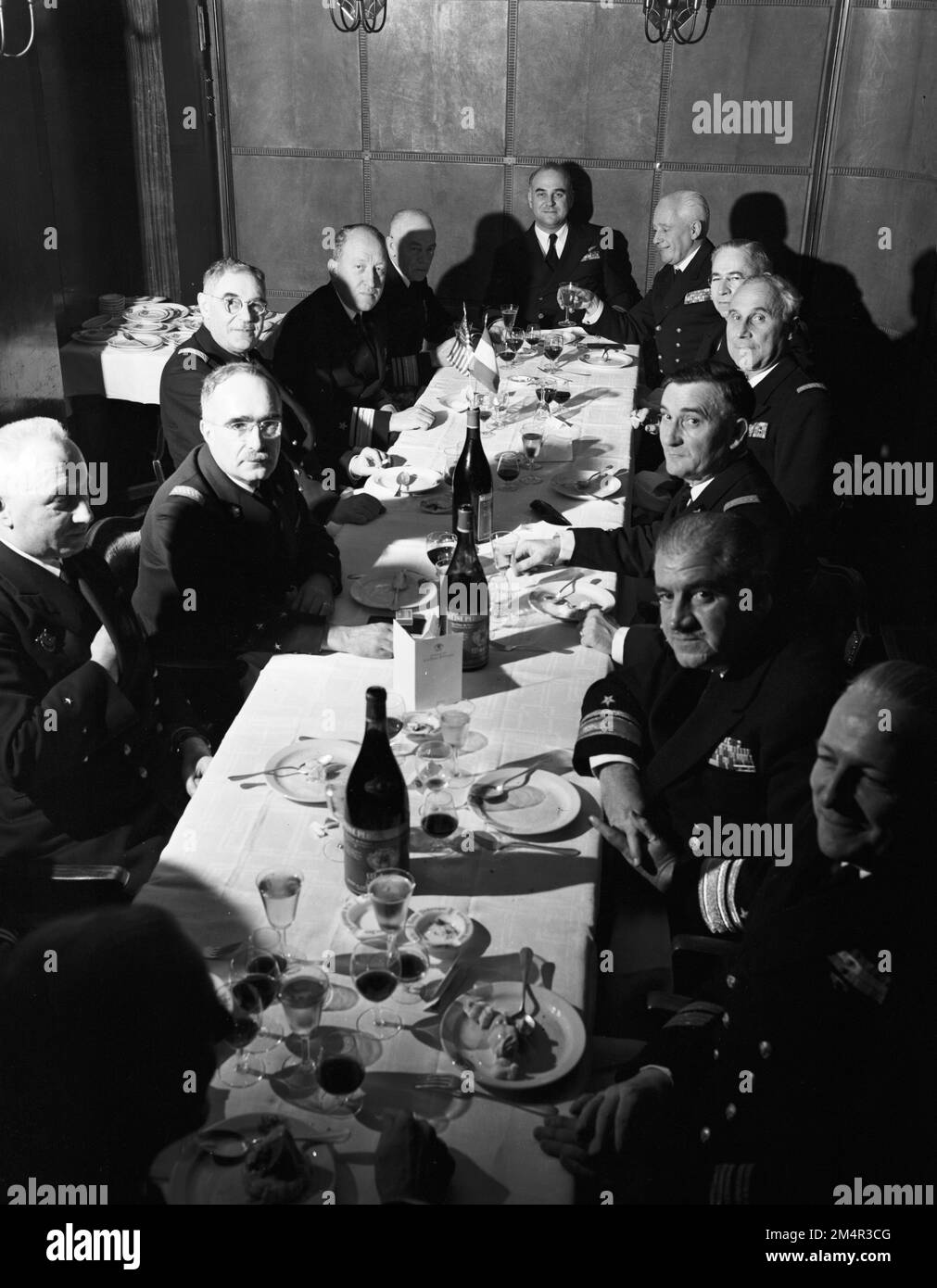 French and U.S. Navy Officials Meet Over Luncheon in Paris. Photographs of Marshall Plan Programs, Exhibits, and Personnel Stock Photo
