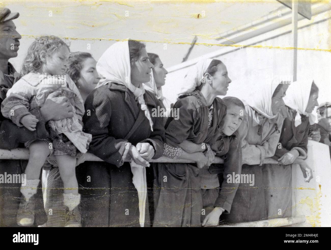 Natives of the Yugoslav Village of Gevgelija Watching the Arrival of American-Aid Flour. Photographs of Marshall Plan Programs, Exhibits, and Personnel Stock Photo