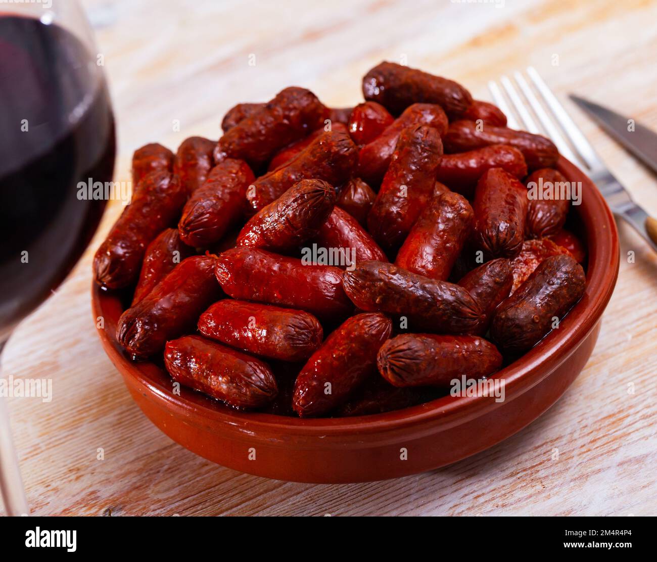 Spanish appetizer, warm mini chorizo sausages Stock Photo Alamy