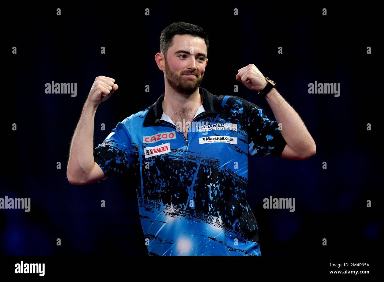 Luke Humphries celebrates defeating Florian Hempel during day eight of