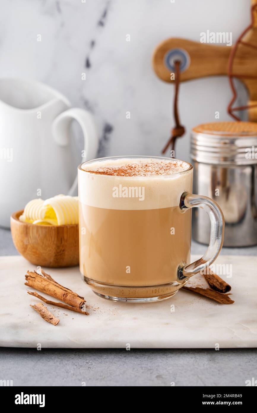 Bulletproof coffee in a glass mug with cinnamon Stock Photo