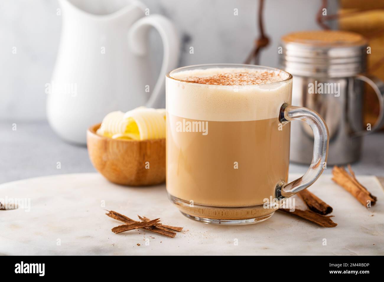 Bulletproof coffee in a glass mug with cinnamon Stock Photo