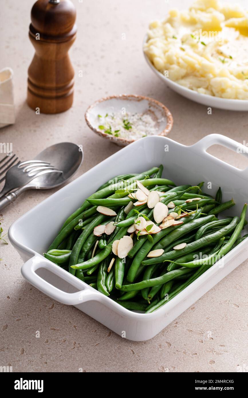 Green beans with sliced almonds, healthy side dish idea Stock Photo Alamy