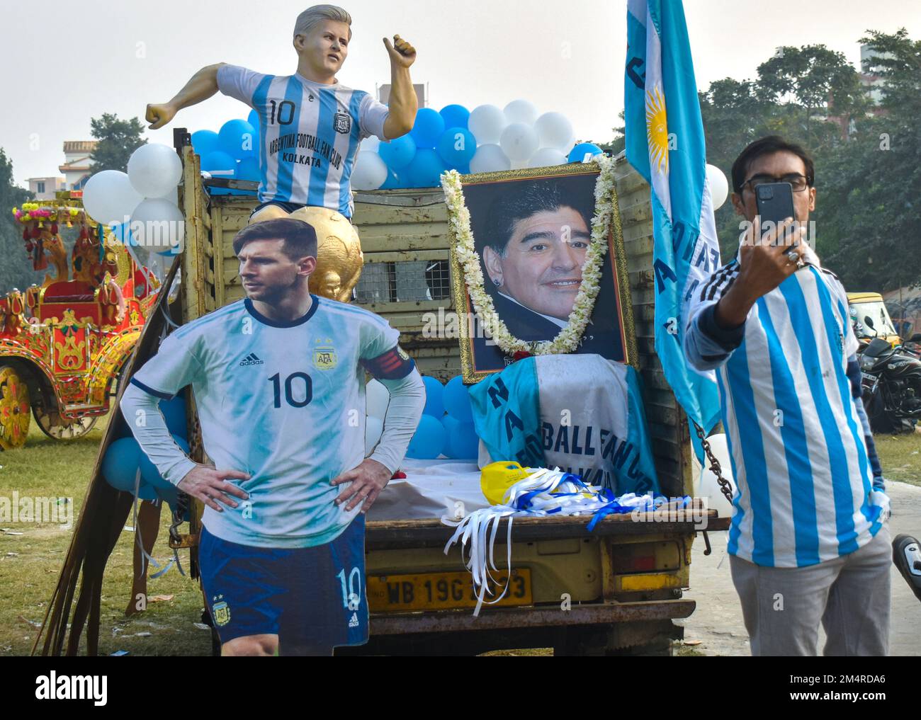 Kolkata, India. 22nd Dec, 2022. Members of the Argentina fan club display life-size cut out of Argentinas football team players during a rally to celebrate their win in the Qatar 2022 World Cup final football match between Argentina and France, in Kolkata. (Photo by Sudipta Das/Pacific Press) Credit: Pacific Press Media Production Corp./Alamy Live News Stock Photo