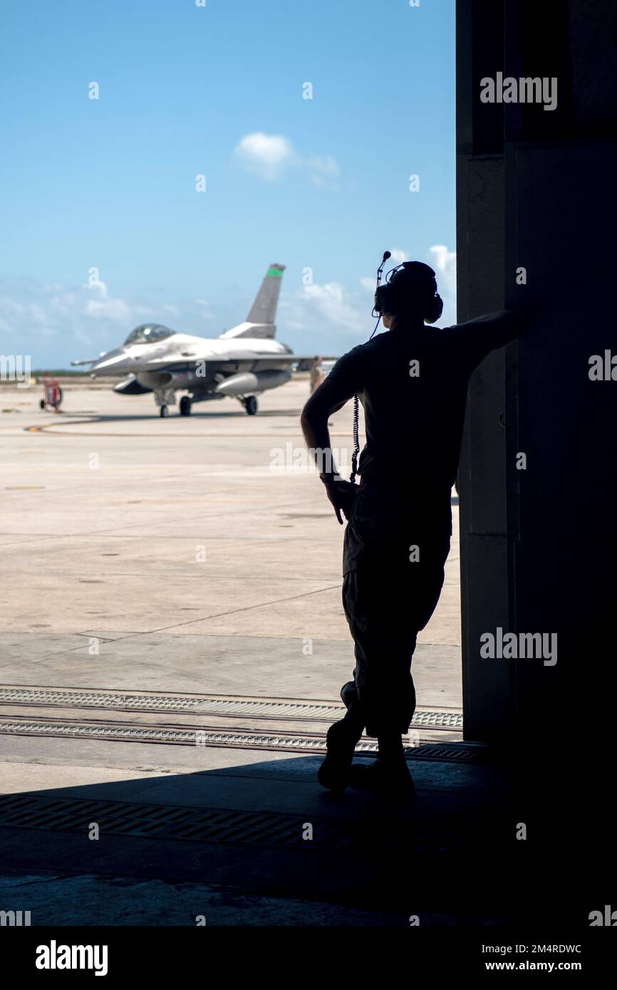 An Airman, assigned to the Ohio National Guard’s 180th Fighter Wing, watches crews prepare for a training flight at Naval Air Station Key West, Fla., Oct. 31, 2022. The 180FW deployed to NAS Key West to train with VFC-111, the Navy's premier adversary squadron, providing realistic training scenarios that ensure the 180FW is prepared for homeland defense and contingency operations around the globe.  (U.S. Air National Guard photo by Staff Sgt. Kregg York) Stock Photo