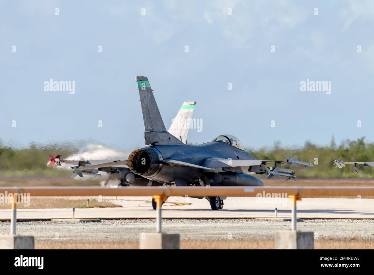 U.S. Air Force F-16 Fighting Falcons, assigned to the Ohio National Guard’s 180th Fighter Wing, taxi to the runway for training flights at Naval Air Station Key West, Fla., Oct. 31, 2022. The 180FW deployed to NAS Key West to train with VFC-111, the Navy's premier adversary squadron, providing realistic training scenarios that ensure the 180FW is prepared for homeland defense and contingency operations around the globe.  (U.S. Air National Guard photo by Staff Sgt. Kregg York) Stock Photo